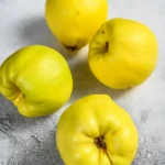 fresh-quince-fruits-on-white-table-white-backgrou-2024-12-09-04-03-28-utc