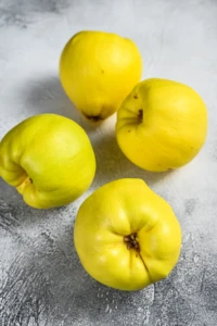 fresh-quince-fruits-on-white-table-white-backgrou-2024-12-09-04-03-28-utc