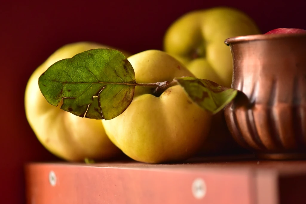fresh-ripe-quinces-on-a-shelf-2024-12-07-13-20-23-utc